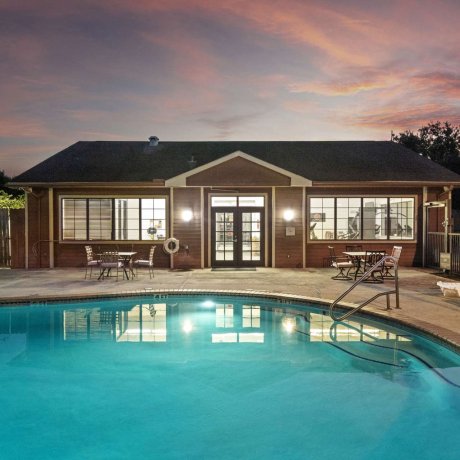 Swimming pool at Allstar RV Resort in Houston TX at twilight