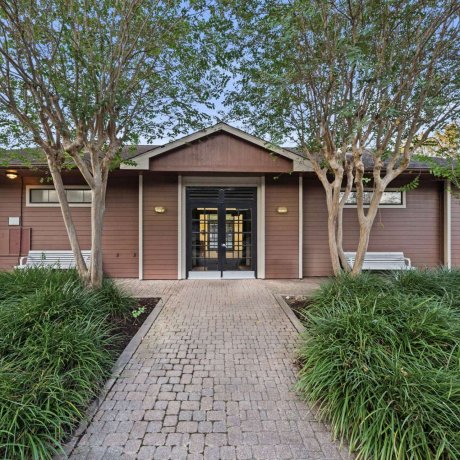 Exterior view of clubhouse at Allstar RV Resort in Houston, TX