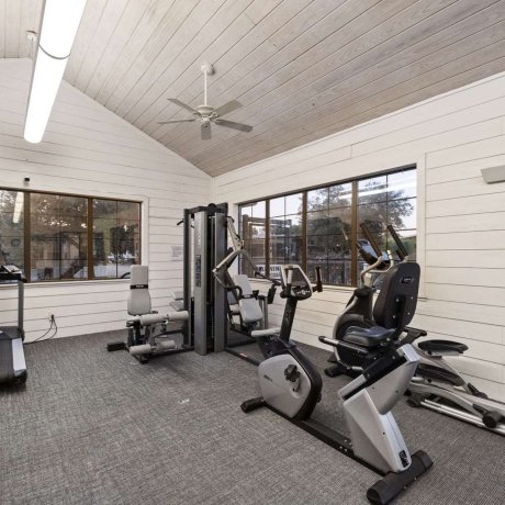 Modern fitness center with cardio and strength equipment at Allstar RV Resort in Houston, TX
