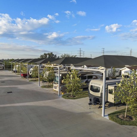 Rows of premium covered RV sites with large shade structures and concrete pads at Lakeview RV Resort