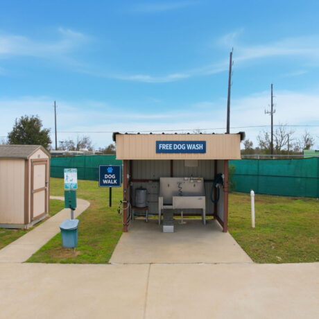 Free dog wash station and pet walk area at Mont Belvieu RV Resort, a pet-friendly RV park near Houston, Texas