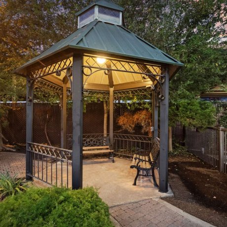 Lighted gazebo with benches at Allstar RV Resort in Houston, TX