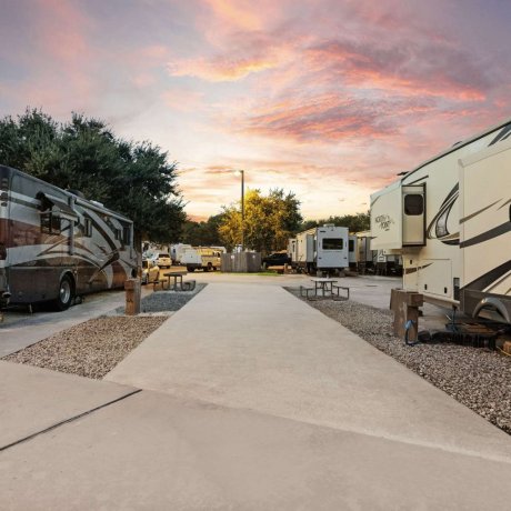 Premium pull-through RV sites at Allstar RV Resort in Houston, TX during sunset