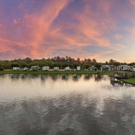 Twilight view of lake and RV sites at Westlake RV Resort in Houston, TX