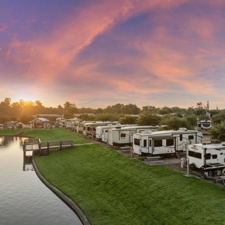 Lakefront RV sites at sunset at Westlake RV Resort in Houston, TX