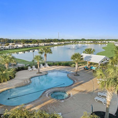Resort pool and pond at Mont Belvieu RV Resort — resort amenities and monthly site options near FM-565, Baytown TX