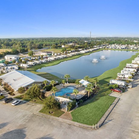 Aerial view of Mont Belvieu RV Resort — pond, pool and monthly RV sites near FM-565 in Baytown, TX