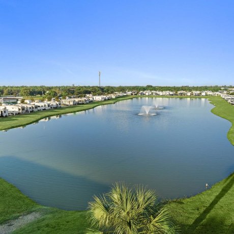 Scenic lake with fountains at Mont Belvieu RV Resort — waterfront views and family-friendly amenities in Baytown, TX