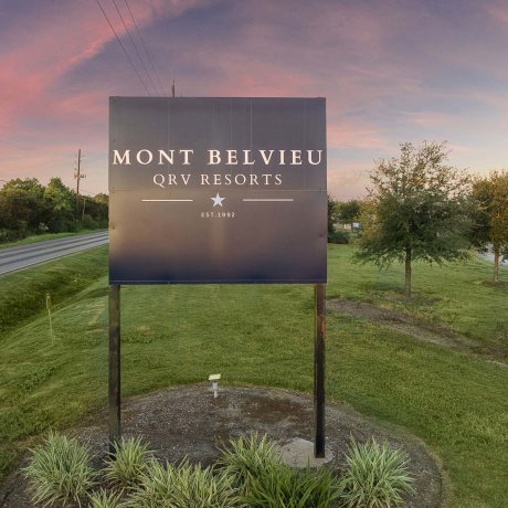 Mont Belvieu QRV Resorts entrance sign at twilight — FM-565 Baytown, TX