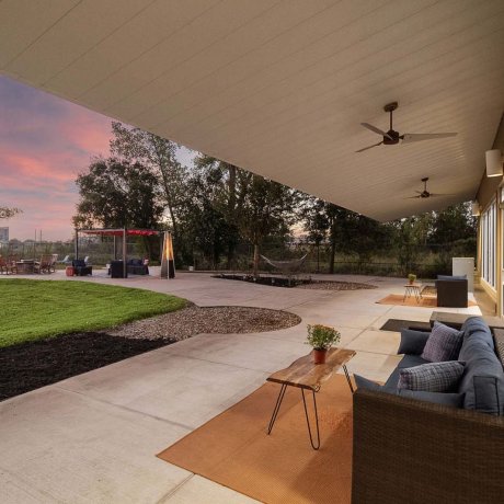 Covered patio with modern outdoor seating at Southlake RV Resort clubhouse