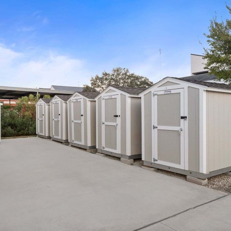 Row of private storage sheds available for rent at Southlake RV Resort in Houston, TX