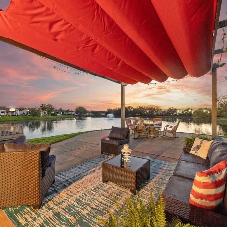 Cozy fire pit with Adirondack chairs overlooking the lake at Southlake RV Resort